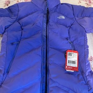 Women’s The North Face puffer jacket size medium.